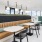 seating area with a booth and tables