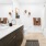 bathroom with a large mirror and sink