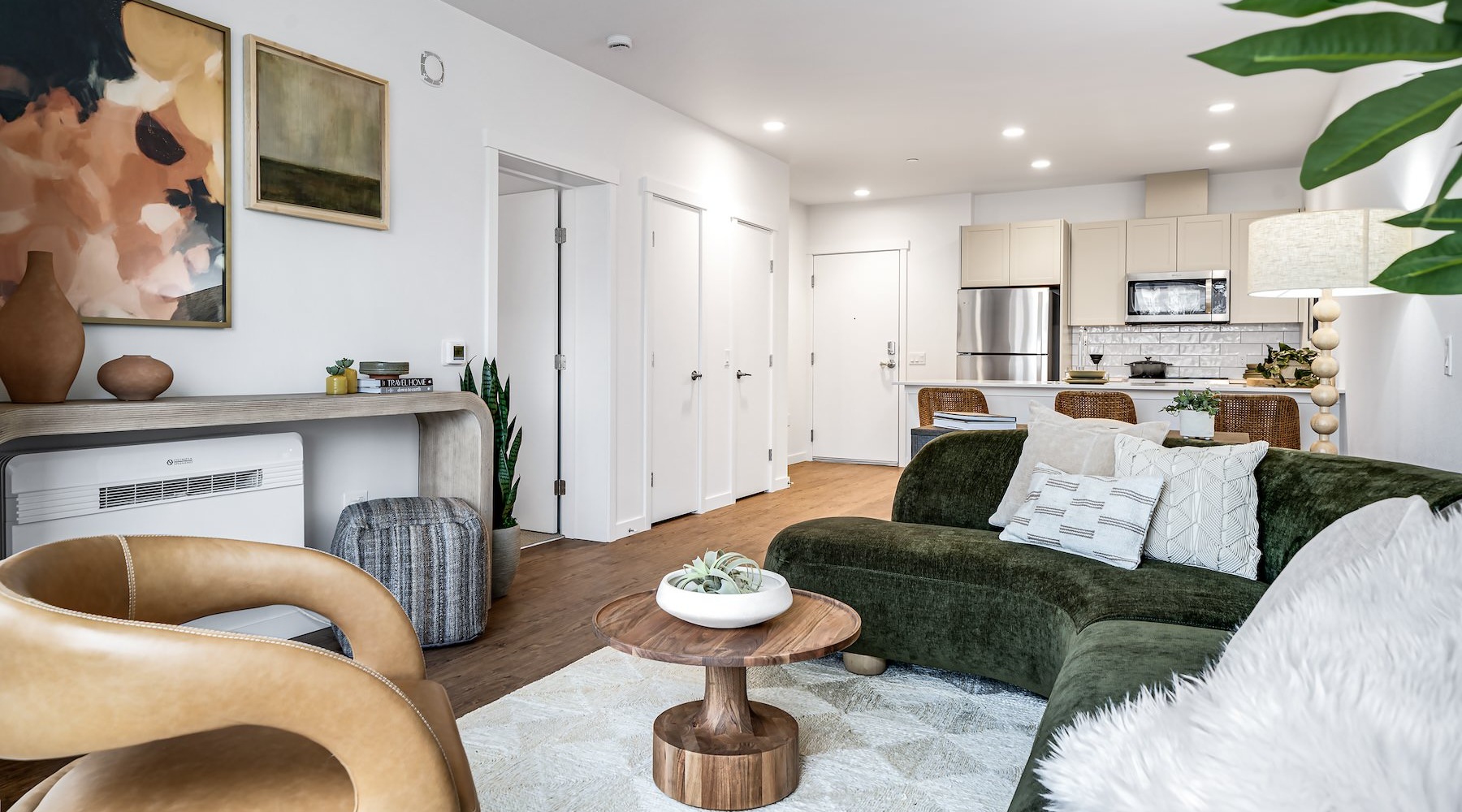 Wide-open living areas perfect for entertaining living room with a couch, chair, and coffee table