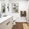 bathroom with a large vanity and mirror