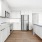 large kitchen with white cabinets