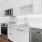 large kitchen with white cabinets