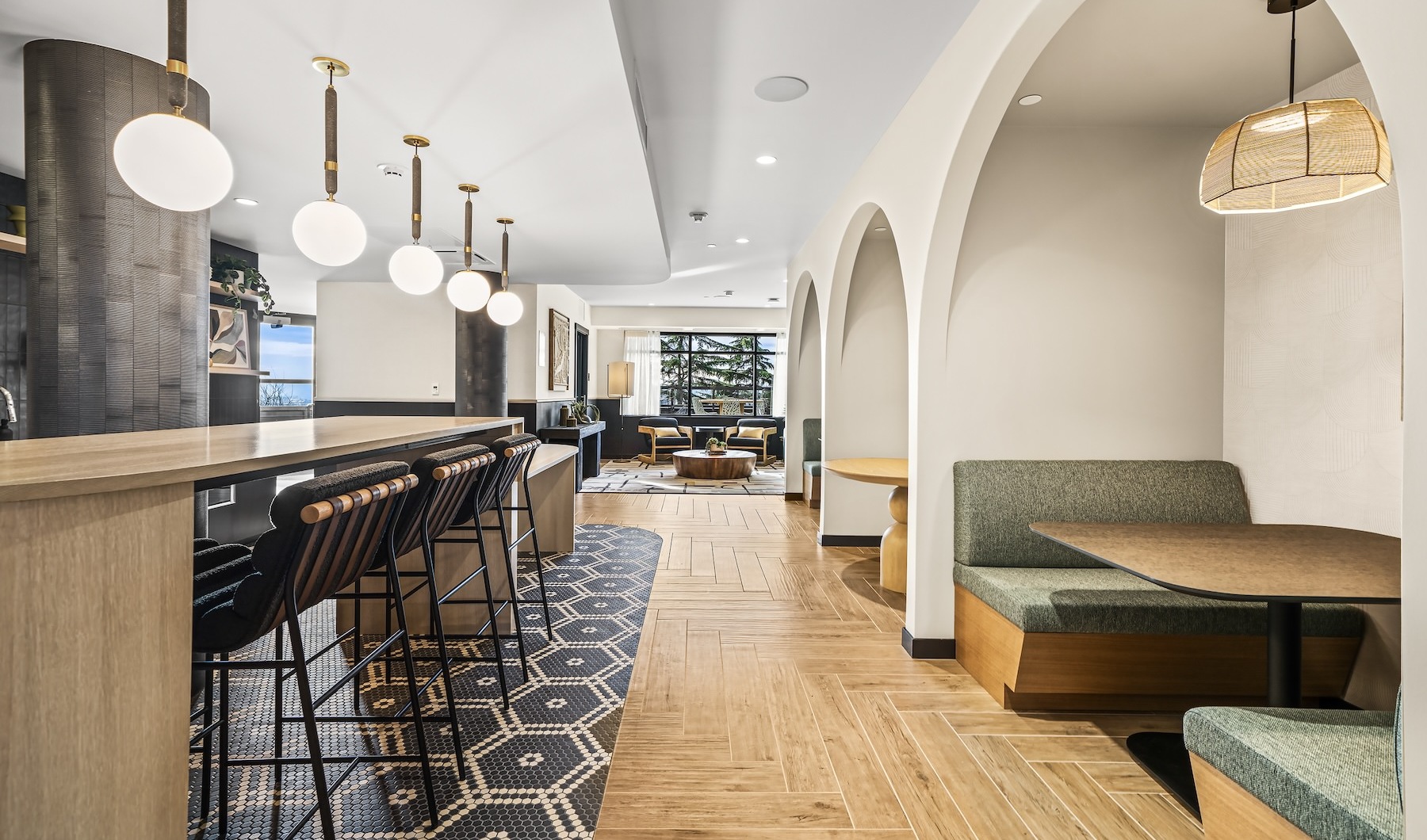 Where comfort and convenience meet cage area with an island and bar stools and booths