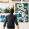 a person looking at art on a wall