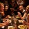 a group of people eating at a restaurant